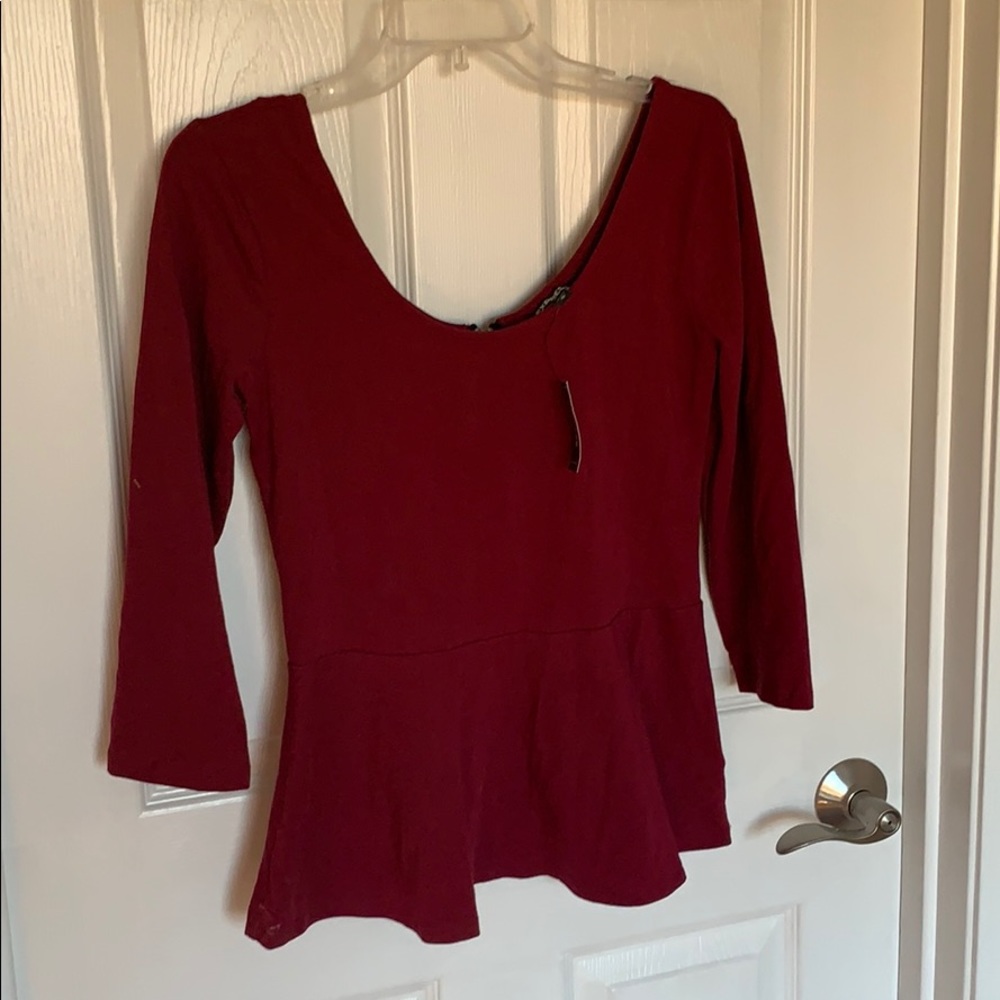 Maroon peplum top. New with tags!